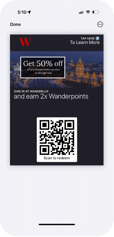 Mobile wallet offer pass displayed on a smartphone, featuring a promotional discount, branded imagery, and a QR code for in-store redemption.