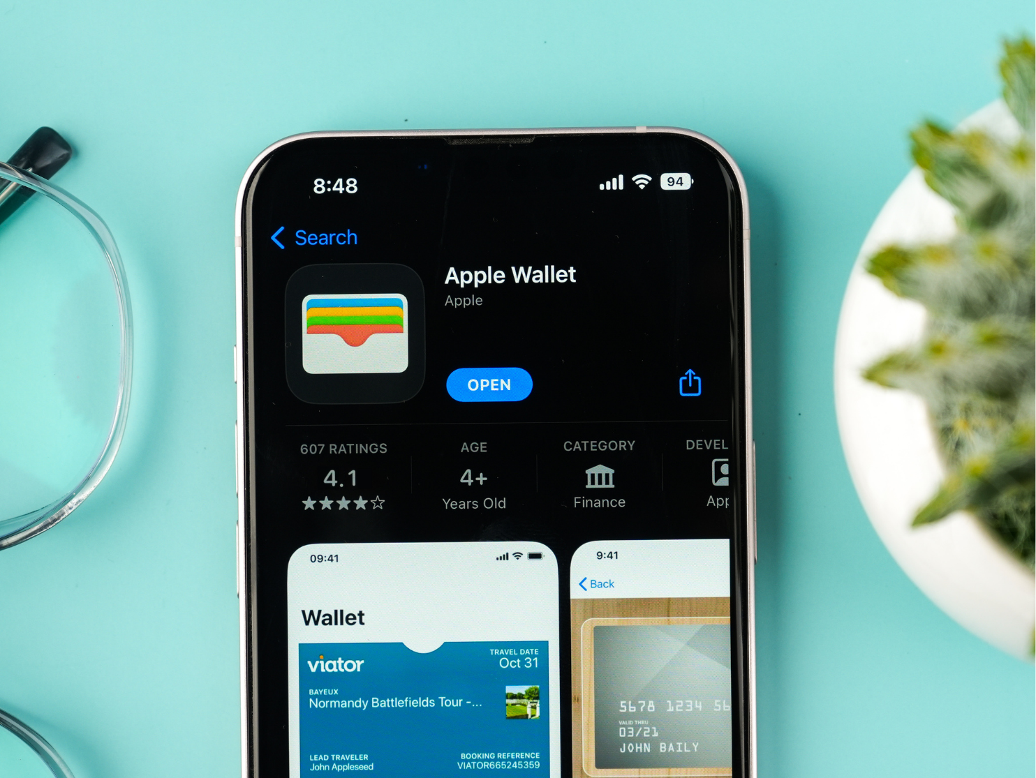 Smartphone displaying the Apple Wallet app page in the App Store, highlighting mobile wallet functionality on a device.